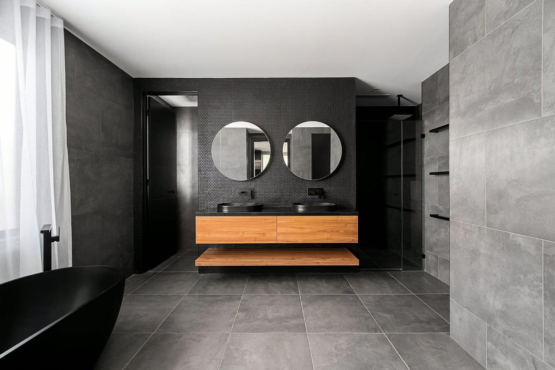 Bathroom with a timber vanity, stone top and a frameless glass shower